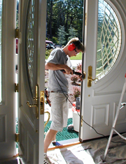 Adjusting strike-plates for proper fit and function on a double- entry door to a home