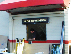 Installing an automated drive- through window at Arby’s in Tigard, Oregon