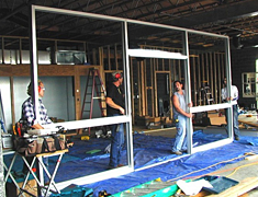 Installing a new storefront door and window assembly in commercial new construction